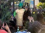 Betsy Johnson poses with Charles Maes, who is dressed like a stalk of asparagus. Maes' Milwaukie restaurant, Casa de Tamales, hosted an event for Johnson on July 7, 2022.