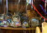Snow globe souvenirs, collected by June Knightly and her wife, Kat Knapp, and displayed at their Portland home, April 7, 2023. Knightly was one of four people shot by Benjamin Smith at Normandale Park in Northeast Portland on Feb. 19, 2022. 