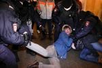 Police officers detain demonstrators in St. Petersburg, Russia, Thursday, Feb. 24, 2022. Hundreds of people gathered in Moscow and St.Petersburg on Thursday, protesting against Russia's attack on Ukraine. Many of the demonstrators were detained. Similar protests took place in other Russian cities, and activists were also arrested.