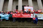 Opponents of a proposed oil terminal in Vancouver, Washington, gather on the steps of the Capitol building in Olympia.