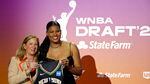 Oregon's Nyara Sabally, on the right, poses for a photo with WNBA commissioner Cathy Engelbert at the 2022 draft.