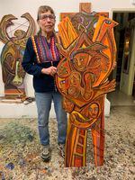 Betty LaDuke with "Almeda Fire, Agony and Resilience," in her Ashland studio.