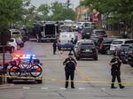 First responders take away victims from the scene of a mass shooting at a Fourth of July parade on July 4, 2022 in Highland Park, Illinois.