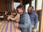 Michael Lish, co-founder of Community Skis, helps Attila Jurecska and his daughter Francesca build a set of custom skis in Southern Oregon during a two-day workshop in March 2022.