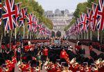 The Queen's funeral cortege borne on the State Gun Carriage of the Royal Navy travels along The Mall on Monday.