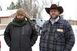 Ammon Bundy (right) stands with a man who described himself as a guard of the Bundy family at the occupied headquarters of the wildlife refuge.