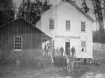 In this image from 1892, residents stand outside the Coos County, Ore., Infirmary, which operated as a local poor farm.