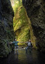 A slot canyon is casually defined as more narrow than tall. Sean Malone, left, and Mike Malone, right, stand at a point in the canyon where it is only two arm spans wide.