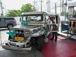 A passenger jeepney driver refuels his vehicle at a gas station in Quezon City, the Philippines, Monday, June 20, 2022.