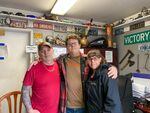 Class of 2025 student Austin with parents Bruce and Amber Clark in their auto shop in Portland on March 30, 2022. Austin spent his freshman year of high school last year learning online.