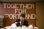 Multnomah County Commissioner and Portland mayoral candidate Jules Bailey eats lunch at his campaign headquarters.
