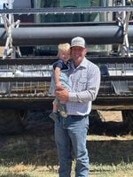 Wheat farmer Ben Maney stands with his son on their Umatilla area farm. The fifth generation wheat farmer is also the president of the Oregon Wheat Growers League.