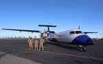 The Universal Hydrogen flight test crew posed for pictures after a successful first flight of the company's hydrogen-electric Dash 8 airliner on March 2, 2023.