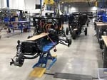 Fun utility vehicles on the Arcimoto production line in Eugene, Ore., in February 2022.