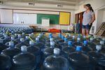 Volunteer Emergency Manager Dorothea Thurby of Warm Springs takes inventory of bottled water Aug. 2, 2019.