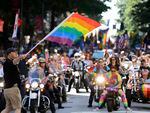 A parade marshal starts the Seattle Pride Parade in 2019. Organizers are paying extra attention to security at Pride events this year after arrests in Idaho.