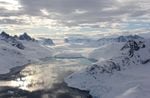 A fjord in Southeast Greenland, shown with marine-terminating glacier in the distance. Polar bears here survive by hunting off freshwater ice that pours into the ocean from glaciers.
