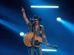 Country music singer Jason Aldean, pictured here performing at the Academy of Country Music Awards in Frisco, Texas, in May, is facing a mixed bag of backlash and praise for a new music video that openly alludes to vigilante justice.