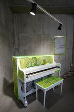 A fluorescent piano designed by artist Chet Malinow for for Piano.  To push.  To play.