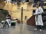 Actors Demetri Tostado, right, and Calista Rodriguez, left, rehearse a scene from a bilingual adaptation of "The Tempest" by Bag & Baggage theater company in Hillsboro.