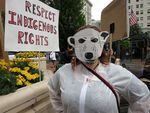 Penny Dex dresses as a polar bear to protest oil and gas drilling in the Arctic.