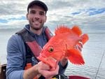 Luke Ovgard holds a Yelloweyed Rockfish he caught and released in summer 2021, one of the more than 1,000 species he's caught.