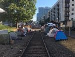 Tents line trolley tracks outside the ICE facility in Southwest Portland, Wednesday, June 20, 2018.