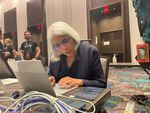 Arati Prabhakar, head of the White House's Office of Science and Technology Policy, tries out the AI challenge at Def Con. The White House urged tech companies to have their models publicly tested.
