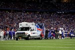 Bills players look on as their teammate Dane Jackson, a longtime friend of Damar Hamlin's, receives medical attention after an injury during a game in September.