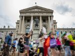 Protesters march outside the Indiana state Capitol building on July 25, 2022, in Indianapolis as activists gathered during a special session. Early last month, Indiana lawmakers passed legislation banning most abortions, which went into effect Thursday. 
