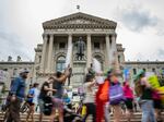 Protesters march outside the Indiana state Capitol building on July 25, 2022, in Indianapolis as activists gathered during a special session. Early last month, Indiana lawmakers passed legislation banning most abortions, which went into effect Thursday.