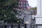 The facade of the East Wing of the White House is demolished by work crews on Wednesday. The demolition is part of President Trump's plan to build a ballroom.