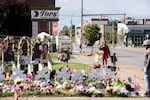 A memorial to the 10 victims of the racist shooting at a Tops grocery store in Buffalo. Two tech companies must face a lawsuit alleging that their algorithms played a role in radicalizing the shooter, a judge ruled Monday.