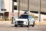 A Waymo autonomous Jaguar electric vehicle is seen in Tempe, Ariz., on the outskirts of Phoenix, on Sept. 15.