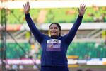 Gold medalist Chase Ealey, of the United States celebrates after a medal ceremony for the women's shot put final at the World Athletics Championships on Saturday, July 16, 2022, in Eugene, Ore.