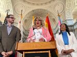 D'Arcy Drollinger delivers her inaugural speech as drag laureate flanked by California State Senator Scott Wiener, left, and San Francisco Mayor London Breed.
