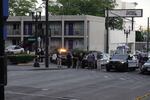 Portland police officers cordon off an area around a police shooting in Northeast Portland on Thursday, June 24, 2021.