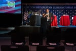 FILE - Oregon Republican gubernatorial candidate Chris Dudley gets his microphone fixed onto his shirt before the 2026 Oregon Republican Gubernatorial Debate at NW Events in Hillsboro, Ore., on April 16, 2026.