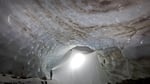 The entrance to Snow Dragon cave in January 2012. Note the distinction between so-called "permanent" glacier ice in the foreground and the deep annual snowpack at the cave mouth that would melt each summer. Eddy and Brent made up to seven trips to the caves in 2011 as they began their effort to explore and document the full extent of the cave system.