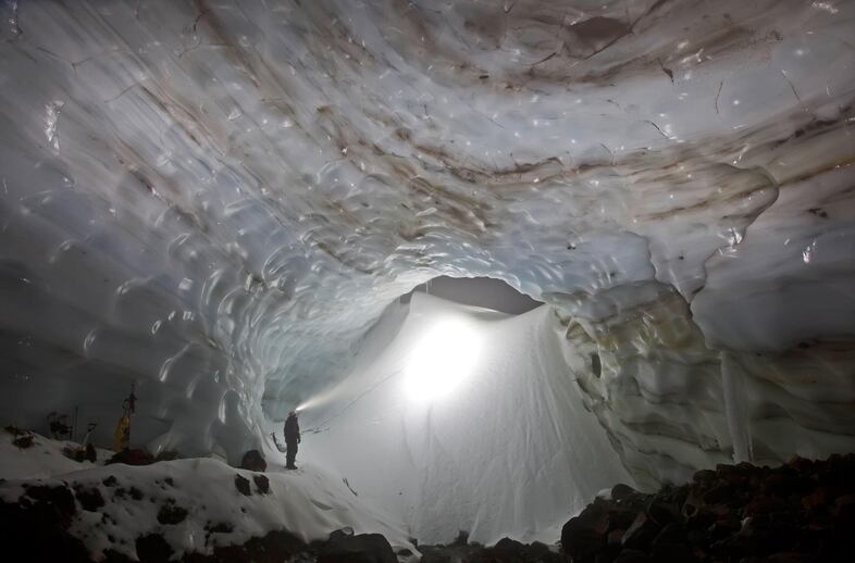 The entrance to Snow Dragon cave in January 2012. Note the distinction between so-called "permanent" glacier ice in the foreground and the deep annual snowpack at the cave mouth that would melt each summer. Eddy and Brent made up to seven trips to the caves in 2011 as they began their effort to explore and document the full extent of the cave system.