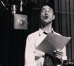 In this undated image, voice actor Pinto Colvig records at Disney Studios.