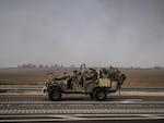Sun., Oct. 8: Trucks carry heavy armored vehicles and tanks of Israeli army as Israel tightens measures by the army, police and other security forces.
