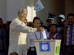 Then African National Congress leader, Nelson Mandela casts his vote April 27, 1994 near Durban, South Africa, in the country's first all-race elections.