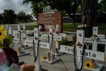 The memorial at Robb Elementary School in Uvalde, Texas. A mass shooting there on May 24, 2022, killed 19 children and two teachers. For surviving families, the year since has been an agonizing fight for answers and accountability.