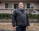 Federico Rostran poses for a portrait in front of in the Parkview Apartments community in Riverdale, Md.