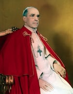 Portrait of Pope Pius XII seated on a throne.