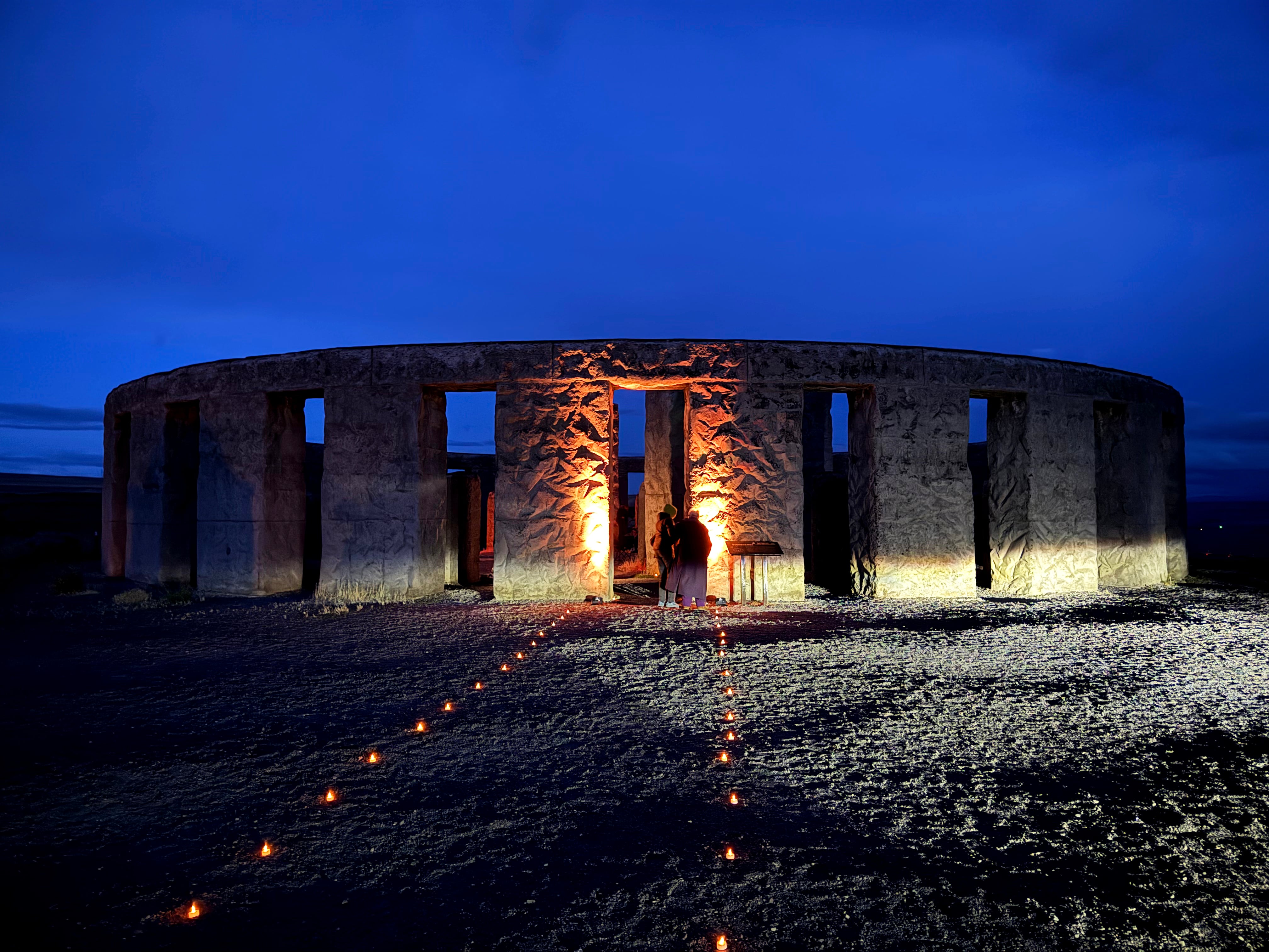 Tealights light the path to the replica Stonehenge, minutes before Maryhill Museum’s first official sunrise summer solstice ceremony is set to begin on June 21, 2025.