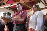 People say the Pledge of Allegiance as part of receiving their citizenship at a Nationalization Ceremony hosted by the Jimmy Carter National Historical Park on Oct. 1, 2024 in Plains, Georgia. The Justice Department is directing its attorneys to prioritize denaturalization in cases involving naturalized citizens who commit certain crimes, according to a June memo.