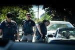 Members of the Portland Police Bureau’s Human Trafficking Unit interrupt a “car date” during a directed patrol mission in Northeast Portland in July.