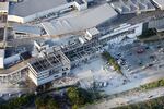 This aerial image shows the damaged AEON shopping center following an earthquake in Kashima, Kumamoto prefecture, southern Japan, Tuesday.
